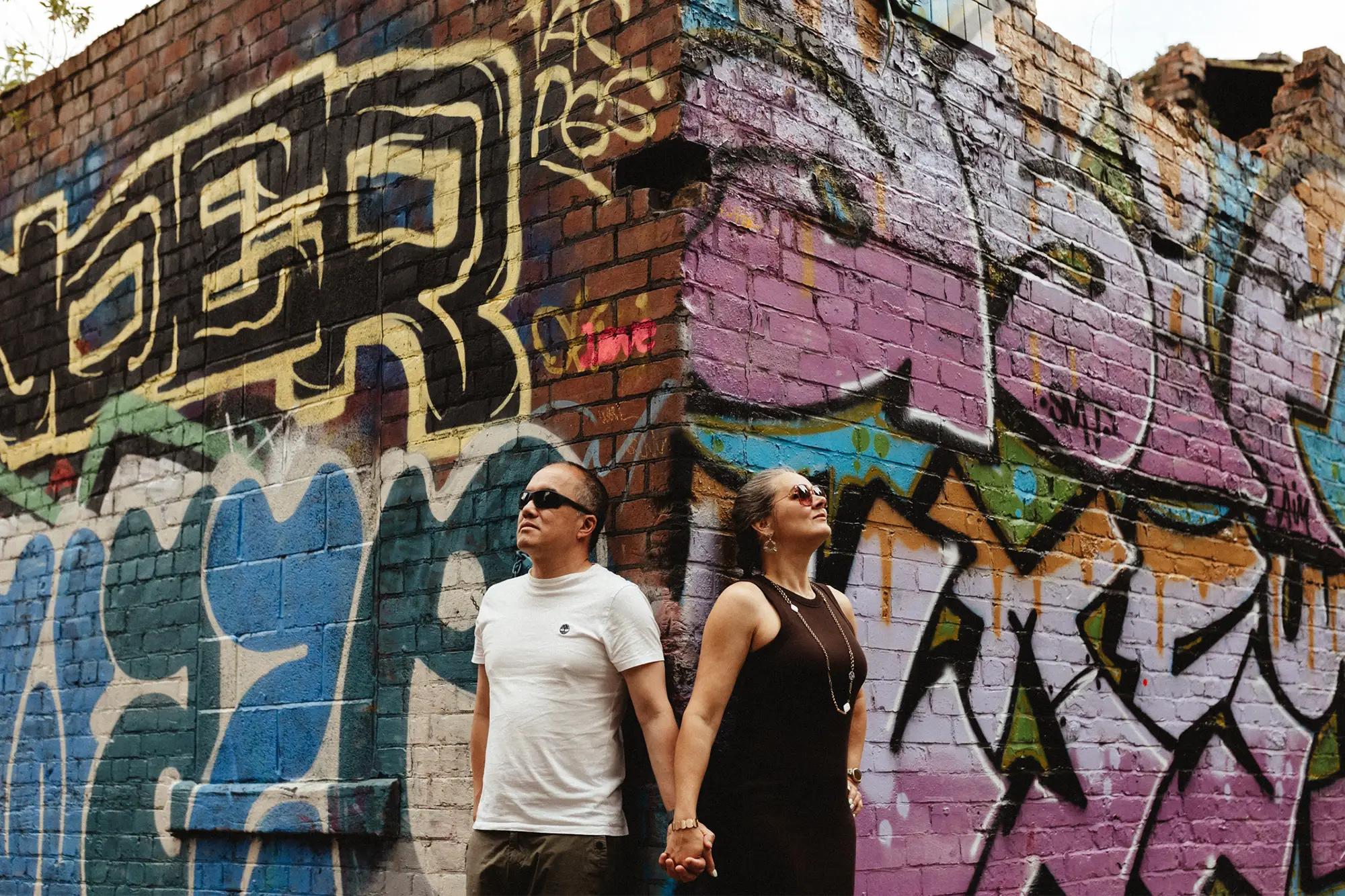 Daiga & Martin standing by a corner of a street