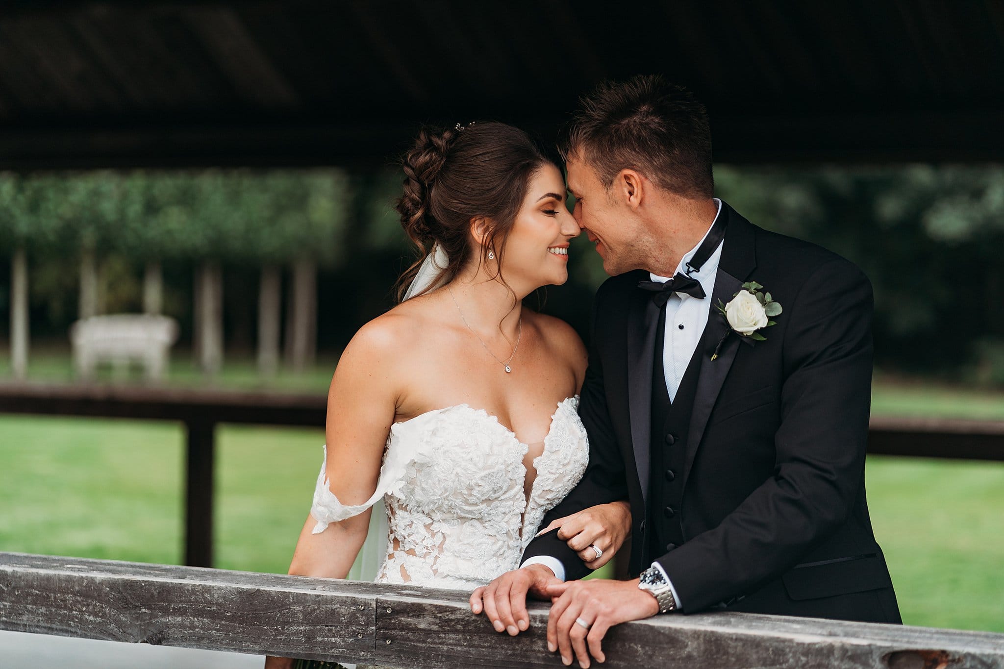 Bride snuggles with groom