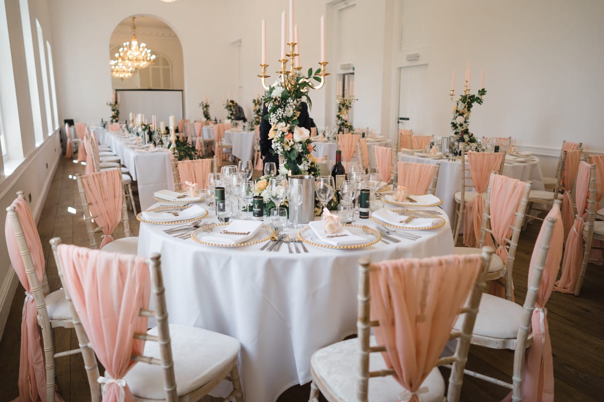The clocktower at Norwood Park set up for a wedding breakfast with round tables